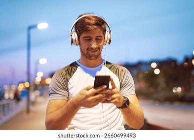 Young Man Listens <b>Music</b> Through Headphones Stock Photo 2660499493 ...