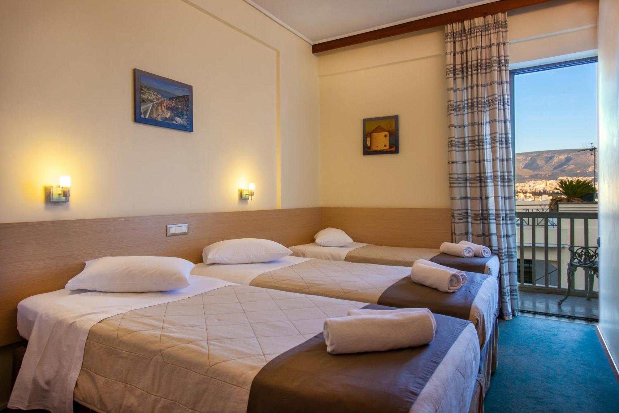 Twin room with extra bed and view to the Acropolis